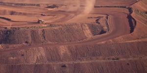 An iron ore truck drives through the Rio Tinto Marandoo mine site on the outskirts of Karijini National Park in Western Australia.