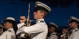 The 125 new navy officers paraded in ceremonial uniform at sunset on Wednesday.