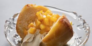 Rum baba with diced pineapple.