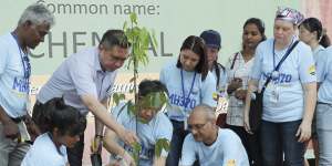 Malaysian Minister of Transport Anthony Loke,third from left,plants a tree at the Day of Remembrance event in Kuala Lumpur.