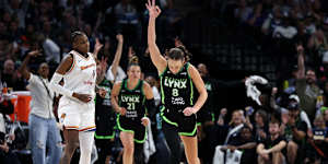 Alanna Smith celebrates a three-point basket against the Phoenix Mercury during the playoff series.