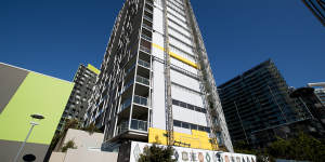 Cladding is removed from the Distillery apartment tower in Pyrmont. 