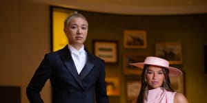Writer Jess Ho in an E Nolan suit and VRC ambassador Demi Brereton wearing a Mossman dress and Morgan&Taylor hat,celebrating the changing dress code at Flemington for Fashions on the Field.