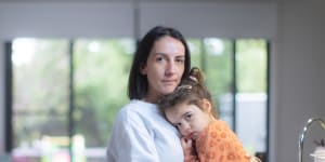 Carla Bottari,with daughter Sophie,is keeping her two children home at the request of her childcare centre,which has been hard hit by COVID.