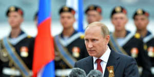 Patriotic speech ... Russian President Vladimir Putin speaks during his visit to the Crimean port of Sevastopol. Authorities in Kiev said Putin's visit to Crimea is a"flagrant violation"of Ukraine's sovereignty.