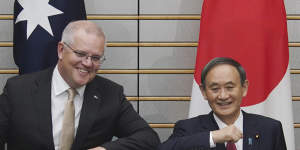 Australian Prime Minister Scott Morrison,left,poses with Japanese Prime Minister Yoshihide Suga at the start of their meeting at Suga's official residence in Tokyo Tuesday,Nov. 17,2020. Morrison is in Japan to hold talks with his Japanese counterpart,Yoshihide Suga,to bolster defense ties between the two U.S. allies to counter China’s growing assertiveness in the Asia-Pacific region. (AP Photo/Eugene Hoshiko,Pool)
