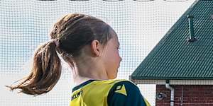 Children at Port Melbourne Primary School train for a student vs staff match as part of Friday’s World Cup celebrations.