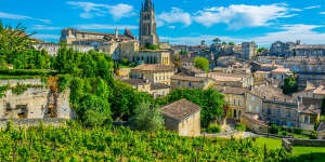 Aerial view of French village Saint Emilion dominated by spire of the monolithic church satnov23franceÂ Uniworld Bordeaux Cruise France;text by Brian Johnston;iStock*** REUSE PERMITTED***Â 