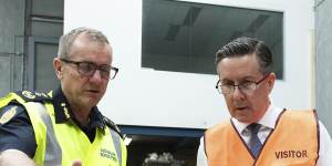 Australia’s Border Force Commissioner Michael Outram and Minister for Health and Aged Care Mark Butler inspect a consignment of seized vapes.