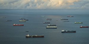 Cargo ships wait to transit the Panama Canal,one of the world’s busiest trade routes.