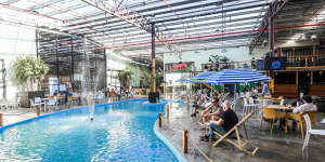 Moon Dog World features a public-pool-blue lagoon with a fountain.