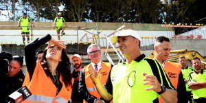 New Zealand Prime Minister Jacinda Ardern meets with builders and construction workers in October 2020.