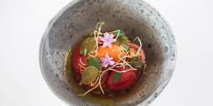 Torched and dried tomatoes with bloody mary sorbet and fermented caper leaves.