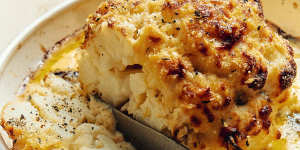 Whole baked cauliflower with comte and parmigiano cheese sauce.