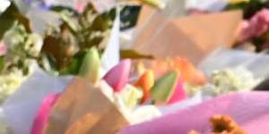 Mourners lay flowers outside the Bondi Pavilion.