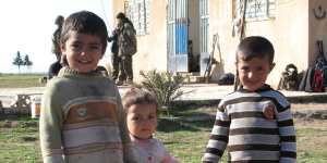 Children on a farm recently freed from Islamic State control. 