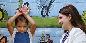 Smart Start’s Michelle Tamaro practices the alphabet with Gabriella Ndaira,4.