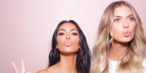 Kim Kardashian and Elle Ferguson at a KKW Beauty launch in 2017.