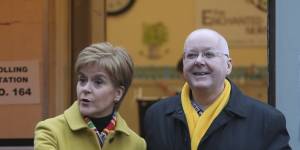 Then-Scottish first minister Nicola Sturgeon poses for the media with husband Peter Murrell,outside polling station in Glasgow,Scotland in 2019.