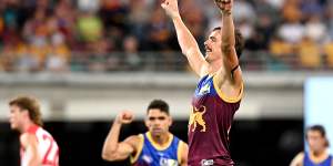 Joe Daniher celebrates after kicking a goal for the Lions.