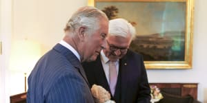 King Charles,then the Prince of Wales,receives a new teddy bear from German President Frank-Walter Steinmeier in Bellevue Castle in Berlin in 2019.