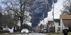  A black plume rises over East Palestine,Ohio,as a result of a controlled detonation of a portion of the derailed Norfolk Southern train.