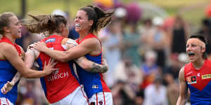 Tayla Harris and the Demons celebrate what turned out to be the match-winning goal.