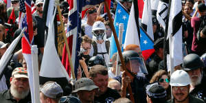 White nationalist demonstrators are surrounded by counter demonstrators in Charlottesville.