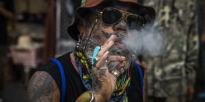 An activist smokes marijuana at a rally to celebrate World Cannabis Day in Bangkok in April.