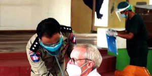Sean Turnell is vaccinated in prison in Myanmar in this image released by the military.