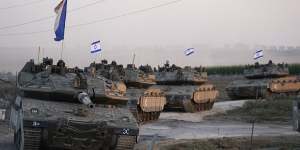 Israeli tanks head towards the Gaza Strip border in southern Israel.