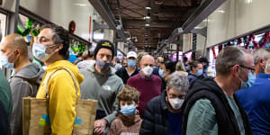 Melburnians wear face masks as they shop at the Queen Victoria Market.