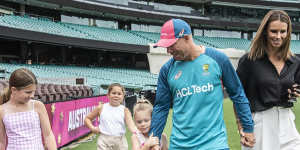 David Warner with his wife Candice and their children at the SCG on Monday.