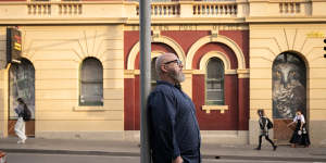 Matt Devine,chair of the jury for the National Trust Heritage Awards,standing outside the old Redfern Post Office at 119 Redfern St,Redfern.