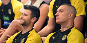 Trent Cotchin and Dustin Martin watch on as Jack Riewoldt announces his retirement.