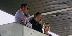 Russell Crowe with Souths CEO Blake Solly and Crowe’s partner Britney Theriot.