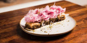 Baklava topped with a toupee of pink fairy floss.