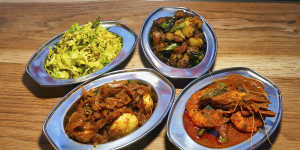 Dishes of egg,cabbage,prawns with okra,and dry pork at Toddy Shop.