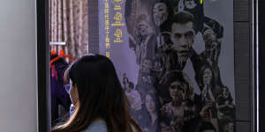 Candy with a poster for Hong Kong film Revolution of Our Times on her bedroom door in Taipei. 