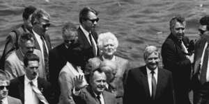 US President George Bush and wife Barbara Bush with security detail at the Opera House in 1992. 