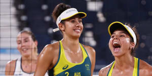 Australia’s Mariafe Artacho del Solar #1 and Taliqua Clancy #2 react after defeating Italy in the beach volleyball preliminary round on Wednesday.