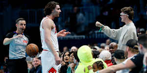 Close confrontation:Josh Giddey clashes with the fan,who was sitting close to the action.