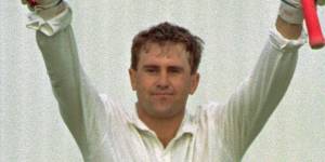 Mark Taylor celebrates a century during the first Test at Old Trafford in 1993.