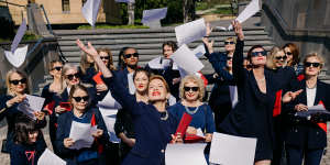 Kirsha Kaechele (centre) and supporters celebrate the Ladies Lounge Supreme Court verdict on Friday morning.