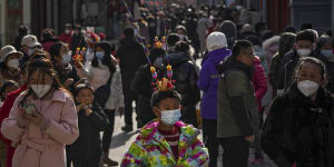 People in a pedestrian shopping street at Qianmen,Beijing,on the first day of the Lunar New Year.