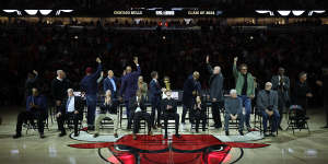 Luc Longley (green jacket) and members of the 1996 Bulls side are presented to the crowd at a Ring Of Honor ceremony at the United Center on January 12. 
