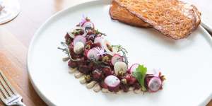 Highly seasoned kangaroo tartare is a sort of reverse Aussie vitello tonnato.