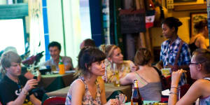 Customers at a restaurant on Sisowath Quay.