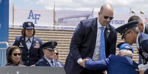 Biden is helped up after falling.
