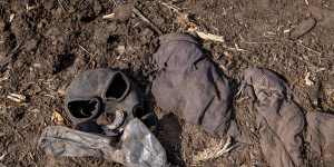 A gas mask is seen on the ground next to a destroyed Russian tank on March 31,2022 in Malaya Rohan,Ukraine.